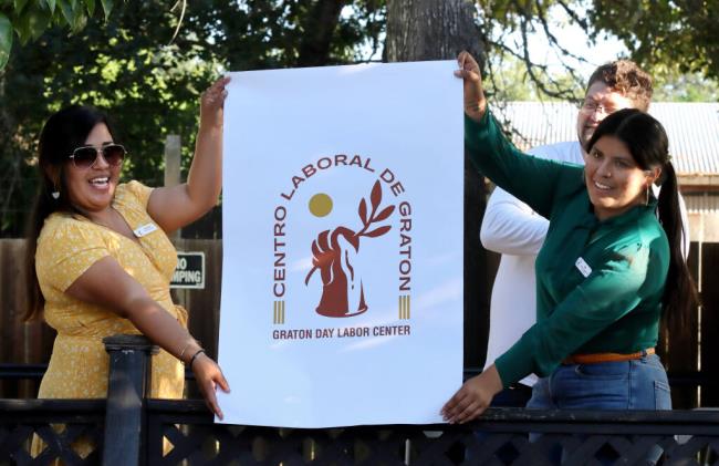 Samantha Rodriguez, Centro Laboral de Graton executive director and also mayor of Rohnert Park, left, and Ada Lopez, Centro Laboral de Graton workforce engagement coordinator, unveil the center's new logo during a celebration for the 20th anniversary of Centro Laboral de Graton at the facility, Thursday, July 20, 2023 in Graton. (Darryl Bush / For The Press Democrat)