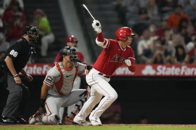 Los Angeles Angels designated hitter Shohei Ohtani grounds out during the seventh inning against the San Francisco Giants in Anaheim, Tuesday, Aug. 8, 2023. (AP Photo/Ashley Landis)