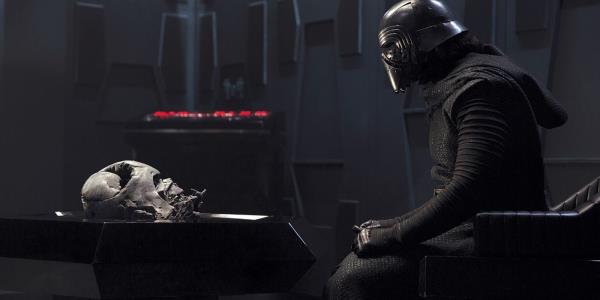 Kylo Ren speaks to Darth Vader's spirit in front of his burned mask in The Force Awakens