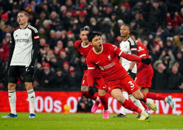 Liverpool's Wataru Endo celebrates scoring his sides third goal.