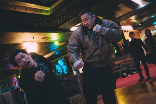 This photo provided by ABO Entertainment and Plus M Entertainment is a scene from the Korean crime action flick, 