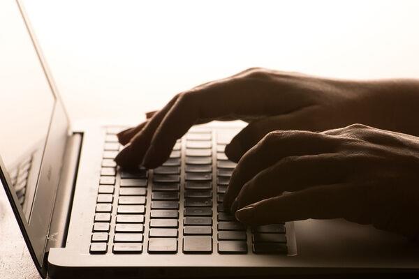A person using a laptop to go on the internet. Picture: PA