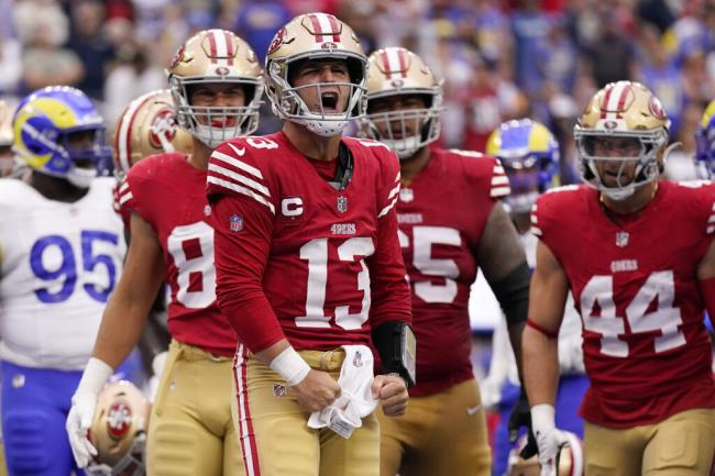 San Francisco 49ers quarterback Brock Purdy, center, celebrates after running in for a touchdown during the first half of an NFL football game against the Los Angeles Rams Sunday, Sept. 17, 2023, in Inglewood, Calif. (AP Photo/Ashley Landis)