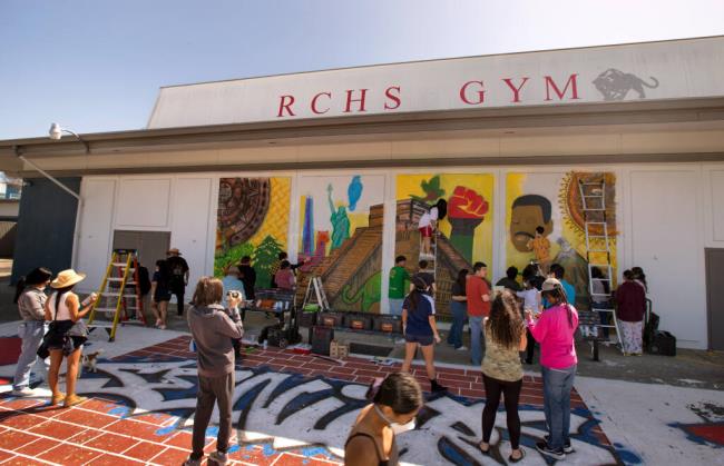 Students work on a mural in the main quad called "Native Us" at Rancho Cotate High School in Rohnert Park, Sunday, April 23, 2023. (Darryl Bush / For The Press Democrat)