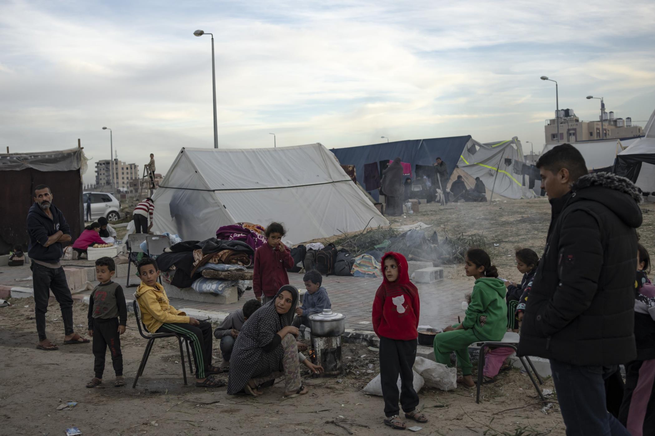 Palestinians displaced by the Israeli ground offensive on the Gaza Strip set up a tent camp in the Muwasi area, Gaza Strip, Dec. 7, 2023. (AP Photo)