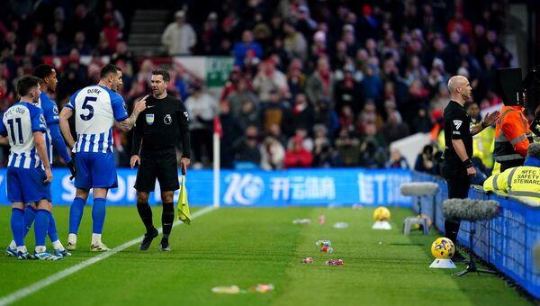 Referee Anthony Taylor reviews a decision on the VAR monitor, and awards a penalty to Nottingham Forest.