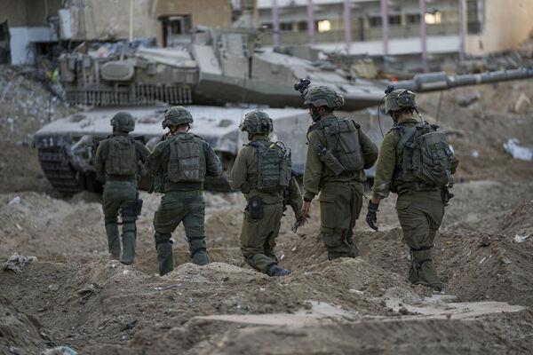 Israeli soldiers are seen during a ground operation in the Gaza Strip. Picture: (AP Photo/Ohad Zwigenberg