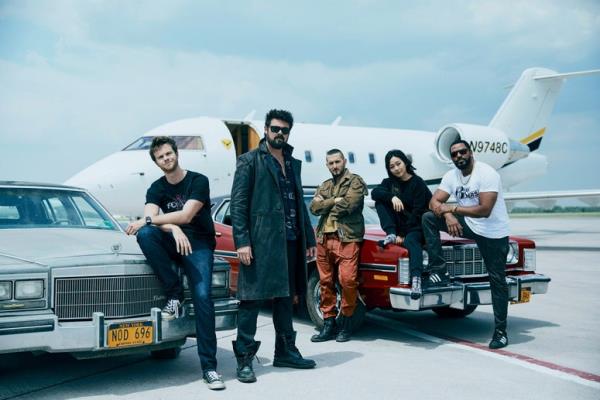 (L-R): Alex Livinalli as Attuma and Mabel Cadena as Namora standing on a street at night in film still from Black Panther: Wakanda Forever.